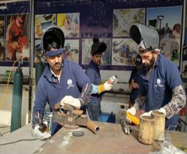Welders at work during a trade test